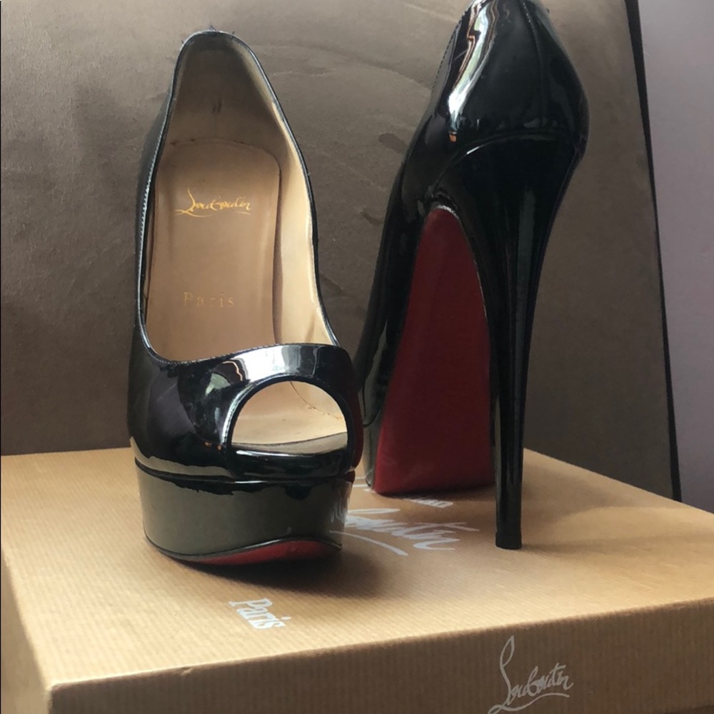 Black Louboutin Peep Toe pumps